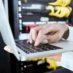 Hand, laptop or programmer working on software coding, programming or 404 error glitch for cybersec